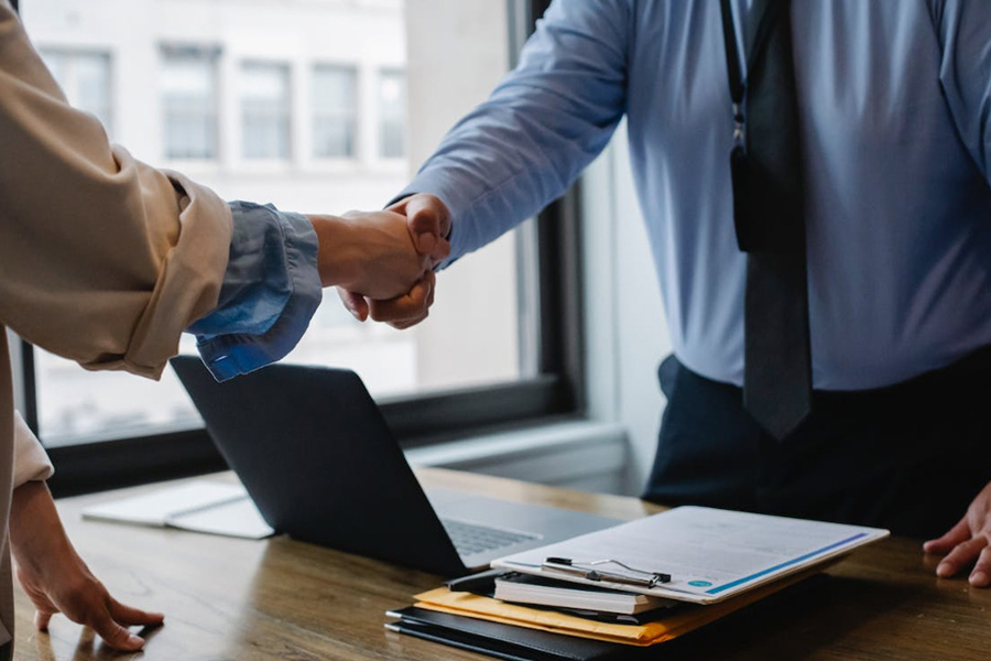 Realtor Shaking Hands With a Client