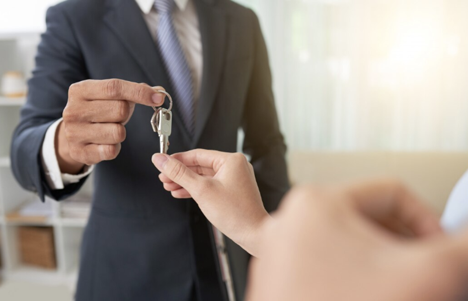 Realtor Handing Over Keys to a Client